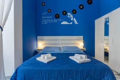 Letto o letti in una camera di Colori e Note