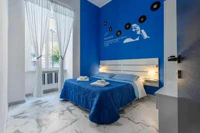 Letto o letti in una camera di Colori e Note