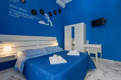 Letto o letti in una camera di Colori e Note
