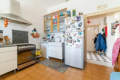 Cucina o angolo cottura di La Terrazza sui Quartieri Stanza e bagno Privati in Appartamento Condiviso