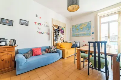 Area soggiorno di La Terrazza sui Quartieri Stanza e bagno Privati in Appartamento Condiviso