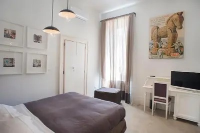 Letto o letti in una camera di Belledonne Suite & Gallery