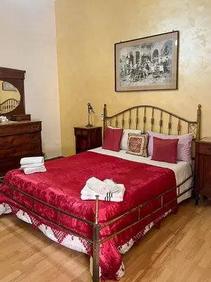 Letto o letti in una camera di Napoli Retro