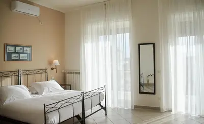 Letto o letti in una camera di Villa Margherita