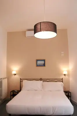 Letto o letti in una camera di Villa Margherita