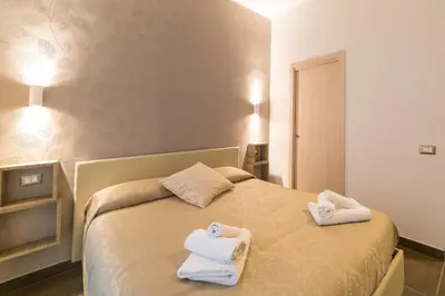 Letto o letti in una camera di Be Italian Flat Bovio