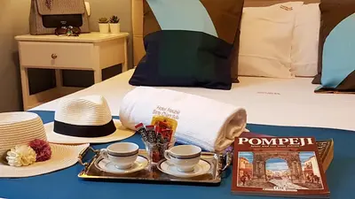 Letto o letti in una camera di Hotel Meublè Santa Chiara Suite