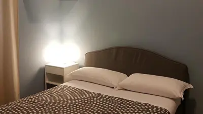 Letto o letti in una camera di Hotel Meublè Santa Chiara Suite