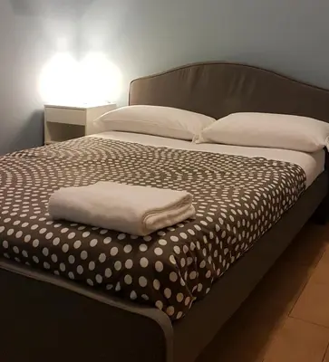 Letto o letti in una camera di Hotel Meublè Santa Chiara Suite