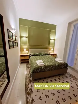 Letto o letti in una camera di Talismano Luxury Suite & Loft & Alcova & Maison