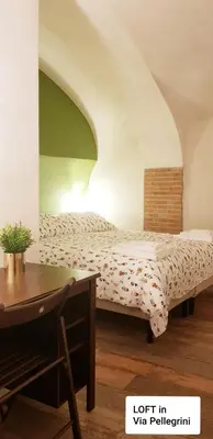 Letto o letti in una camera di Talismano Luxury Suite & Loft & Alcova & Maison