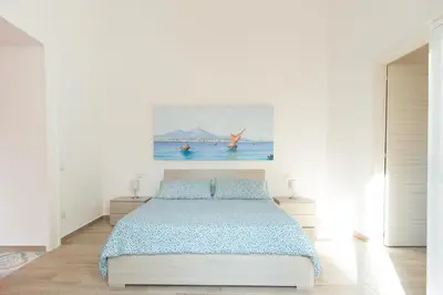 Letto o letti in una camera di In...Napoli B&B