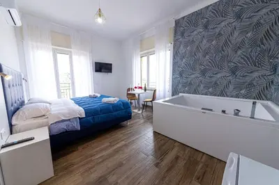 Letto o letti in una camera di Nel Cuore di Parthenope