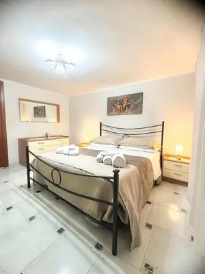 Letto o letti in una camera di Welcome House
