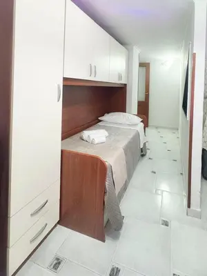 Letto o letti in una camera di Welcome House