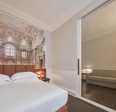 Letto o letti in una camera di Palazzo Caracciolo Naples