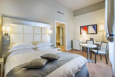 Letto o letti in una camera di Palazzo Caracciolo Naples
