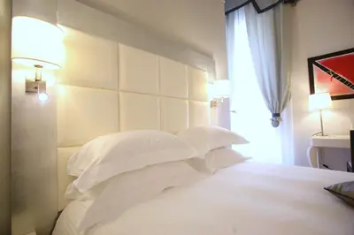 Letto o letti in una camera di Palazzo Caracciolo Naples