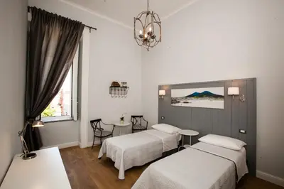 Letto o letti in una camera di Largo Donnaregina Home