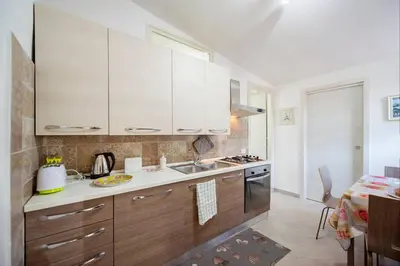 Cucina o angolo cottura di GARDEN HOUSE Apartments in Naples