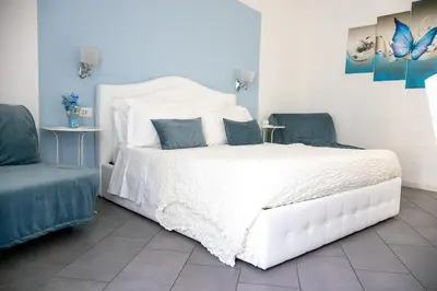 Letto o letti in una camera di Sotto le Stelle ai Decumani