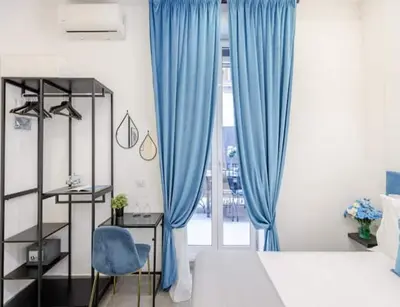 Letto o letti in una camera di I Colori di Napoli