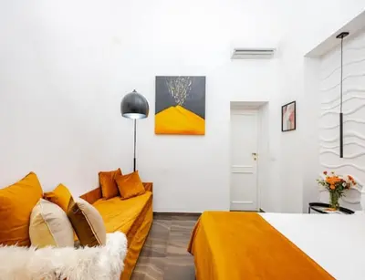 Letto o letti in una camera di I Colori di Napoli
