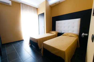 Letto o letti in una camera di Fly Boutique Hotel