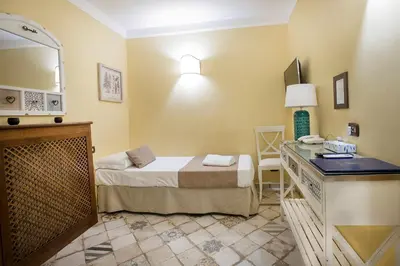 Letto o letti in una camera di Dependance