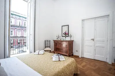 Letto o letti in una camera di Casa Napoletana - San Domenico
