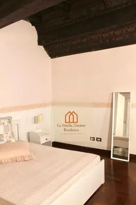Letto o letti in una camera di Le Sorelle Duomo