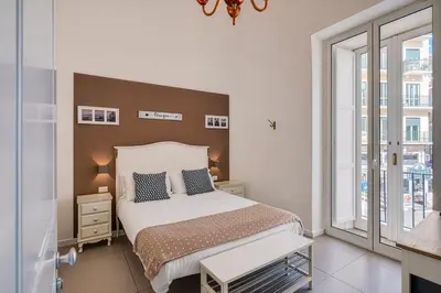 Letto o letti in una camera di A Casa di Anna - Dimore Partenopee