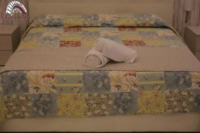 Letto o letti in una camera di Palazzo D'Atri