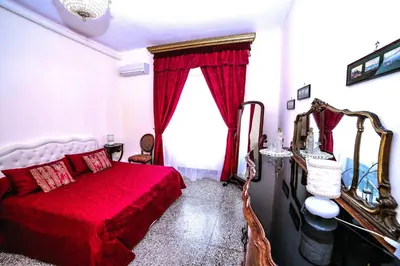 Letto o letti in una camera di WELL COME - Santa Lucia