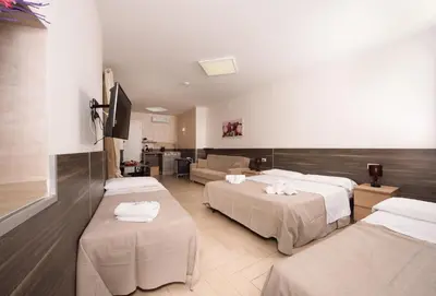 Letto o letti in una camera di Chiaia Relax