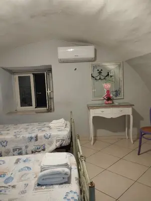 Letto o letti in una camera di Palazziello Nanninella