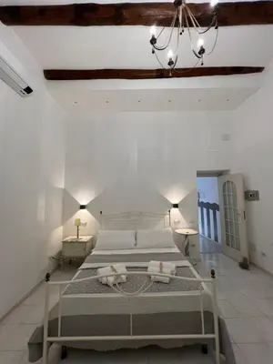 Letto o letti in una camera di Varriale Apartaments 2,0 free parking for small cars only