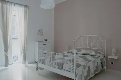 Letto o letti in una camera di Sfumature Partenopee