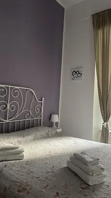 Letto o letti in una camera di Sfumature Partenopee