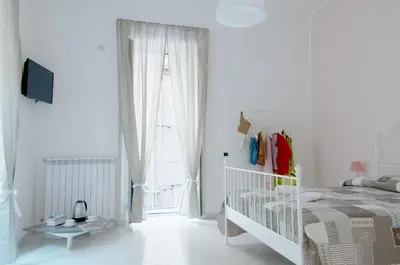Letto o letti in una camera di Sfumature Partenopee