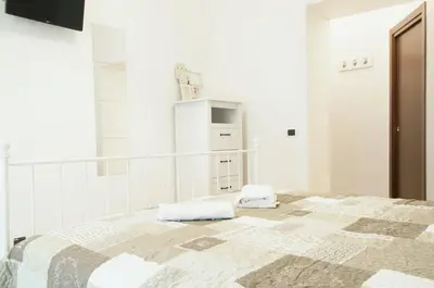 Letto o letti in una camera di Sfumature Partenopee