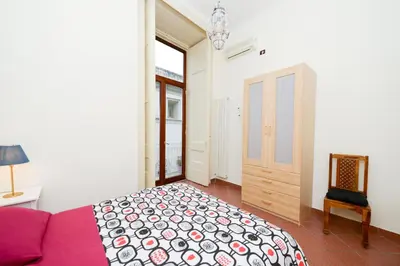 Letto o letti in una camera di Residenza Santa Chiara