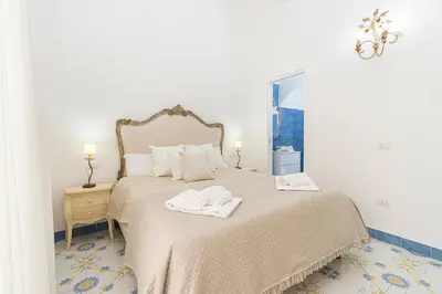 Letto o letti in una camera di NapulitanDream Duomo