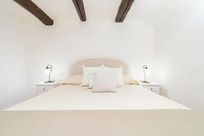 Letto o letti in una camera di NapulitanDream Duomo