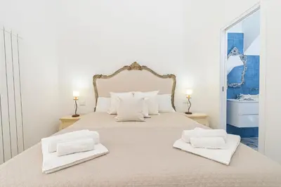 Letto o letti in una camera di NapulitanDream Duomo
