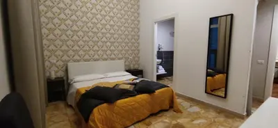 Letto o letti in una camera di B&B Rettifilo