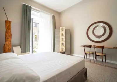 Letto o letti in una camera di Atelier Inès Arts & Suites