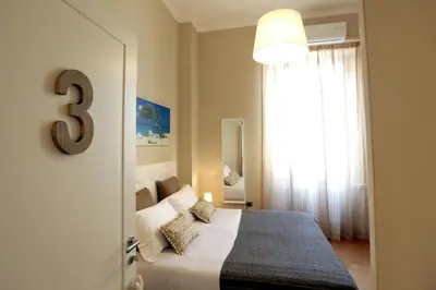 Letto o letti in una camera di I Vicerè B&B Deluxe