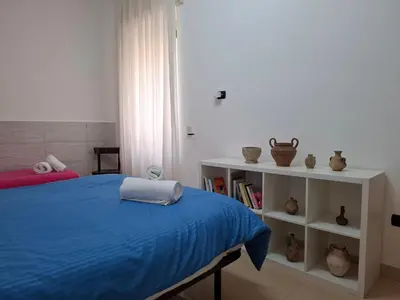 Letto o letti in una camera di Dimora Filangieri