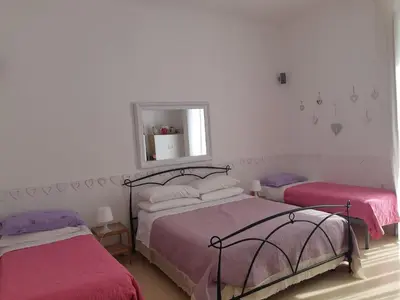 Letto o letti in una camera di Dimora Filangieri